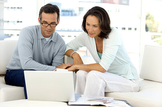 A married couple in a laptop video conference